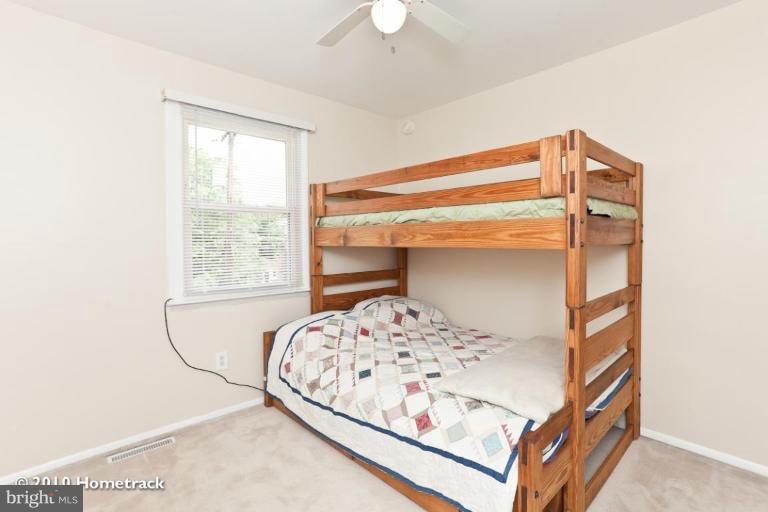 8423 Kings Ridge Road Parkville, MD 21234 - Photo 11 of 21 a bedroom with a bed and a window