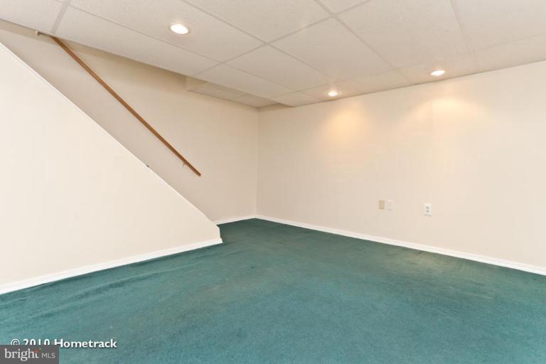 8423 Kings Ridge Road Parkville, MD 21234 - Photo 14 of 21 a view of a big room with an empty space