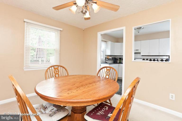 8423 Kings Ridge Road Parkville, MD 21234 - Photo 7 of 21 a view of a dining room with furniture