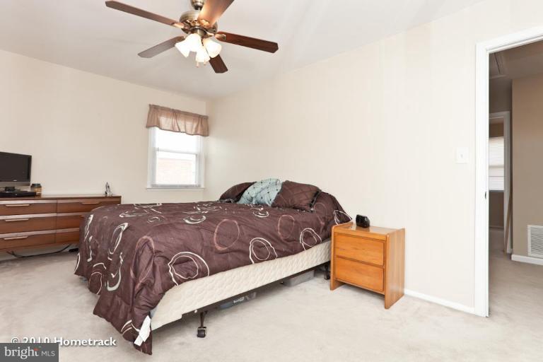 8423 Kings Ridge Road Parkville, MD 21234 - Photo 10 of 21 a bedroom with a bed and window