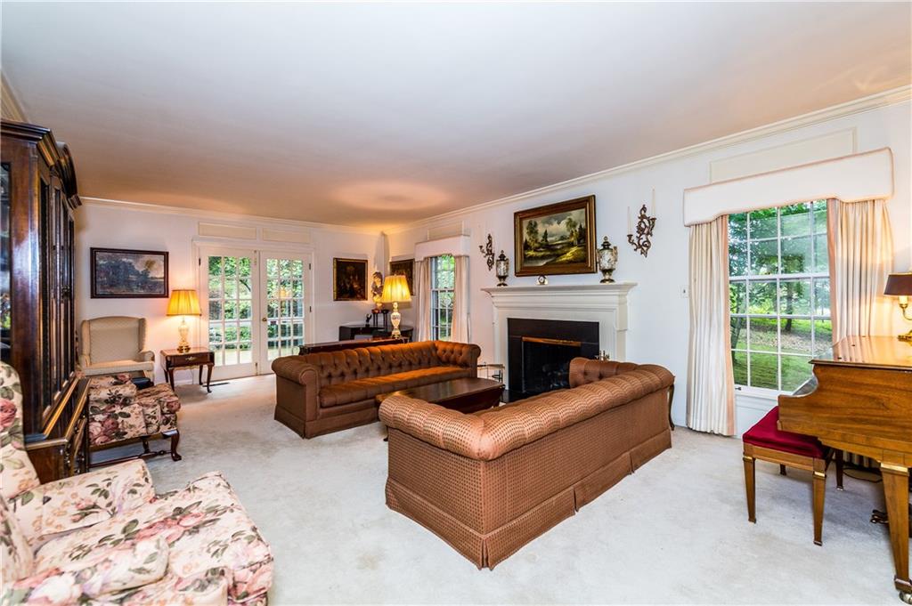 1624 Powers Run Road Pittsburgh, PA 15238 - Photo 2 of 25 LIVING ROOM 27X15: Stunning room to entertain your family and friends. French doors leads to your omni stone patio. Living room has a gas fireplace and walls with large windows.