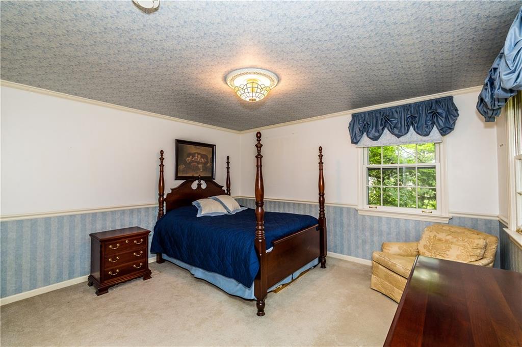 1624 Powers Run Road Pittsburgh, PA 15238 - Photo 17 of 25 3RD BEDROOM 14X13: Double closet, chair rail crown molding and hard wood floors make up this bedroom.