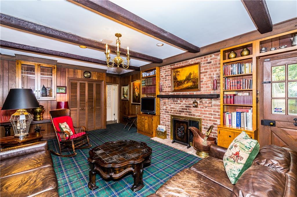 1624 Powers Run Road Pittsburgh, PA 15238 - Photo 8 of 25 FAMILY ROOM 23X13: Brick gas fireplace, dutch pantry door leads to patio, built in shelves along with a wet bar behind the closet doors.
