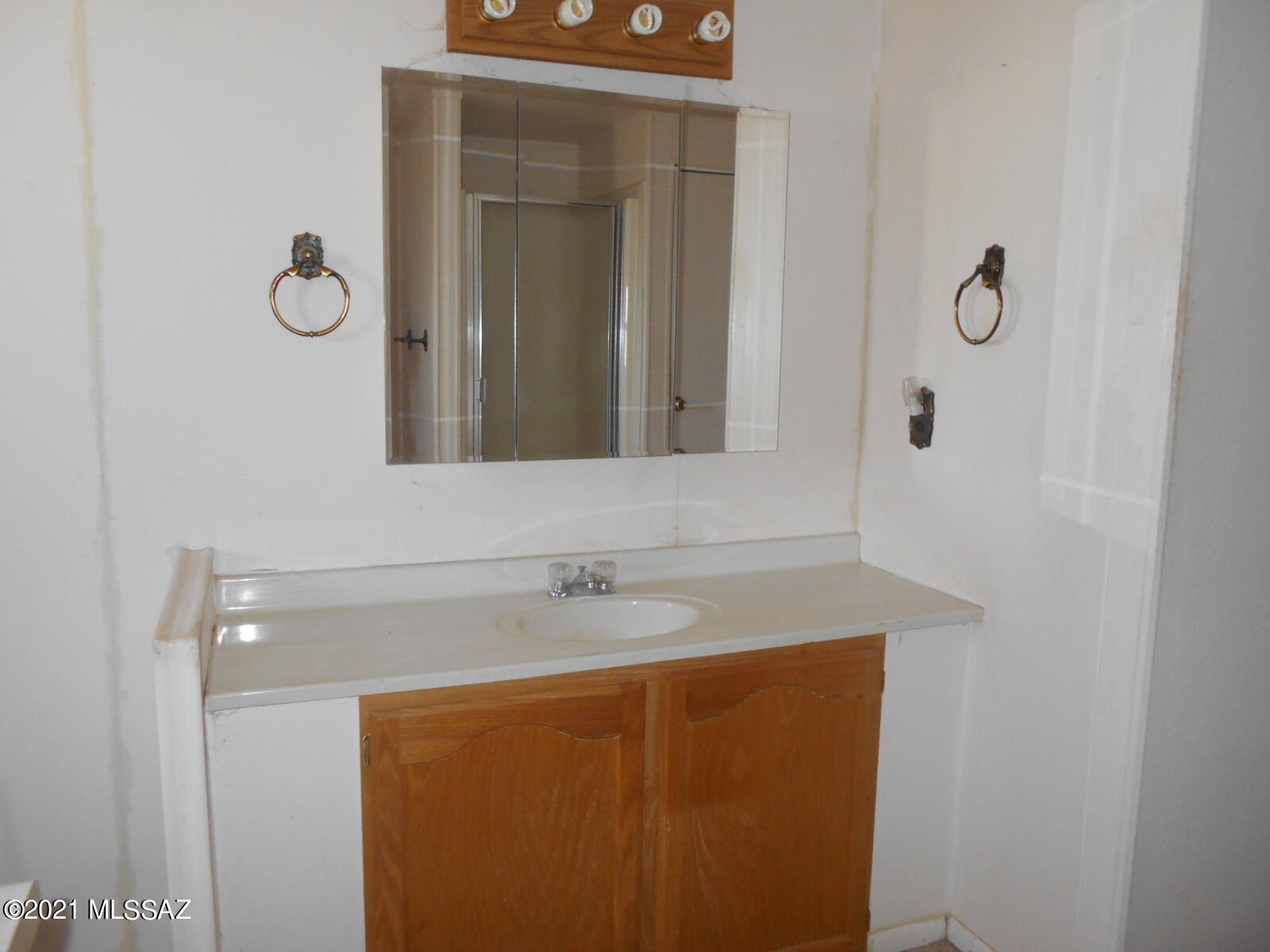 5321 North Rocky Road Douglas, AZ 85607 - Photo 30 of 41 a bathroom with a sink and a mirror