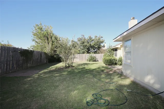 a view of a back yard of the house