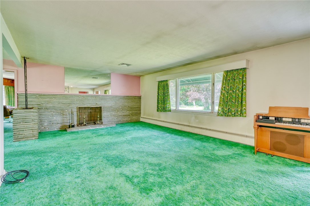 492 Drumm Road Webster, NY 14580 - Photo 9 of 48 LIVING ROOM - WOOD BURNING FIREPLACE