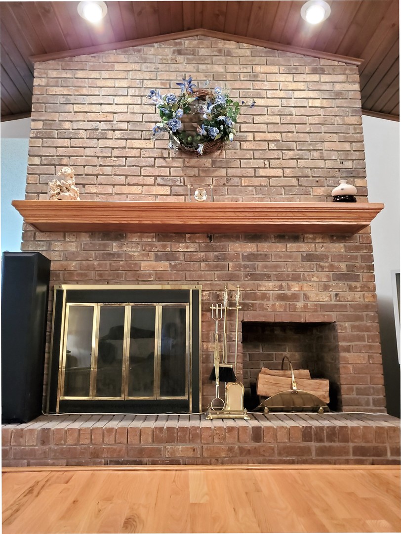 1013 Galen Drive Champaign, IL 61821 - Photo 13 of 68 a view of a fireplace with a window