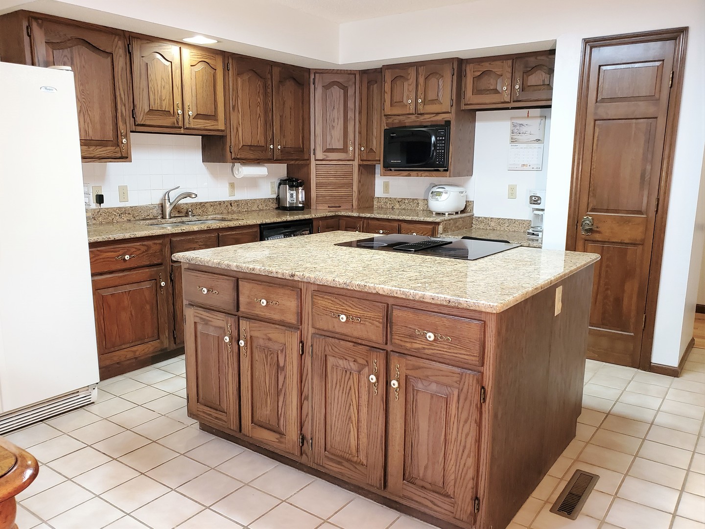 1013 Galen Drive Champaign, IL 61821 - Photo 16 of 68 a kitchen with a sink stove and refrigerator