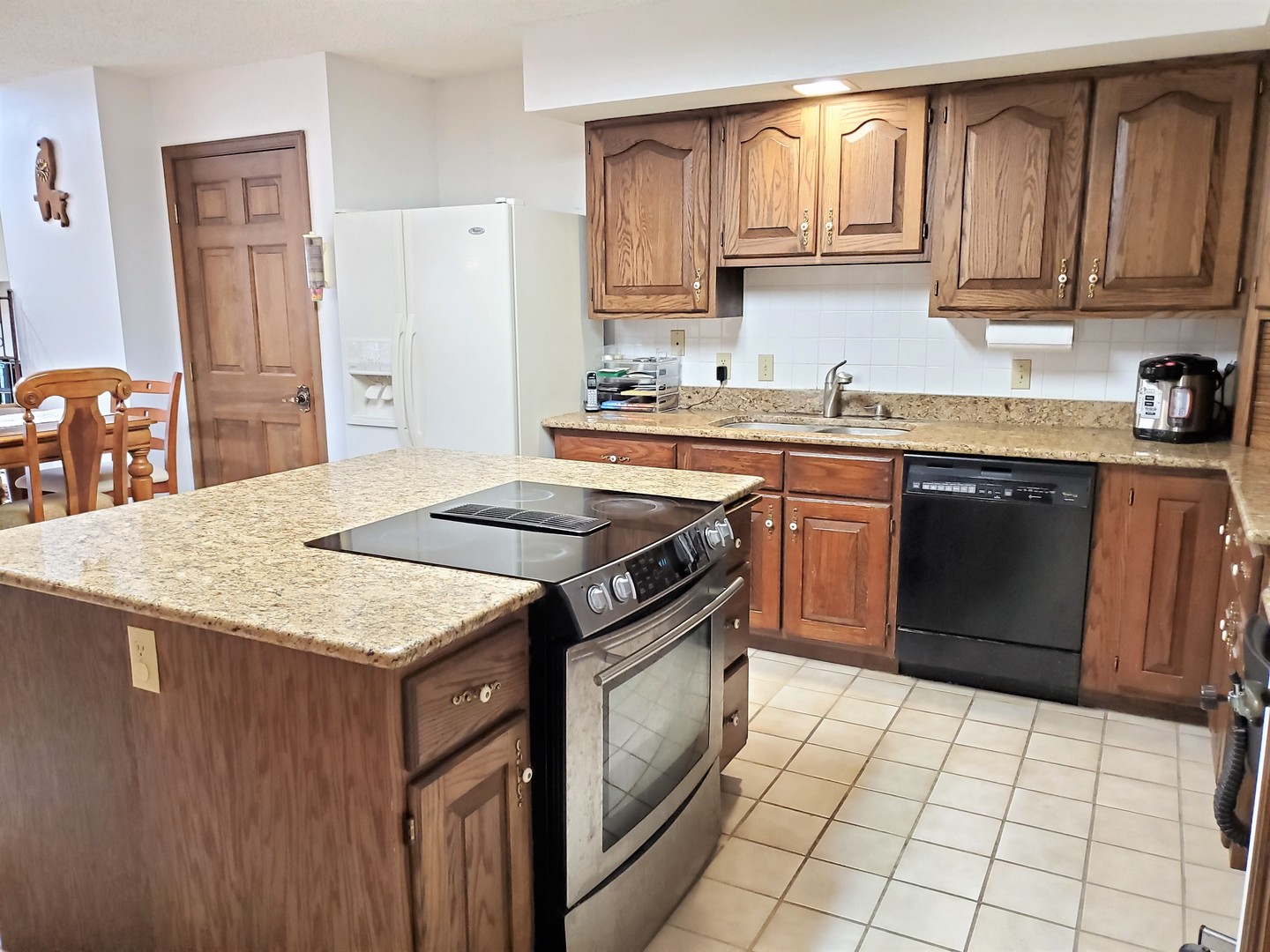 1013 Galen Drive Champaign, IL 61821 - Photo 18 of 68 a kitchen with a stove sink and cabinets