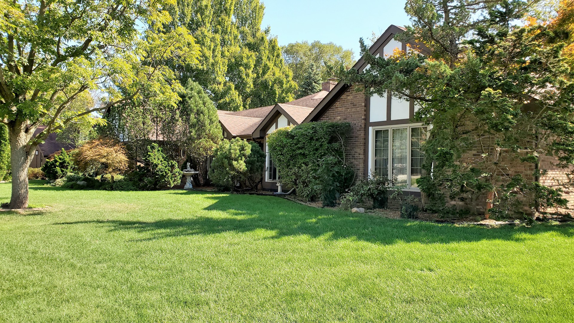 1013 Galen Drive Champaign, IL 61821 - Photo 3 of 68 a front view of a house with a yard and trees