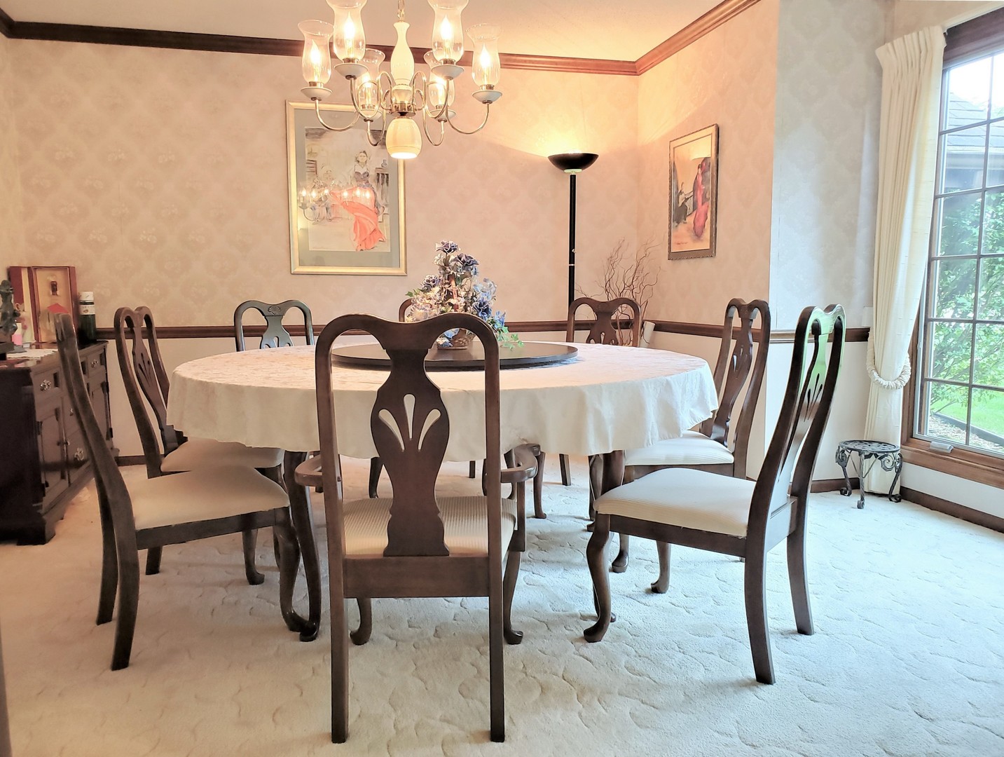 1013 Galen Drive Champaign, IL 61821 - Photo 21 of 68 a view of a dining room with furniture and a chandelier