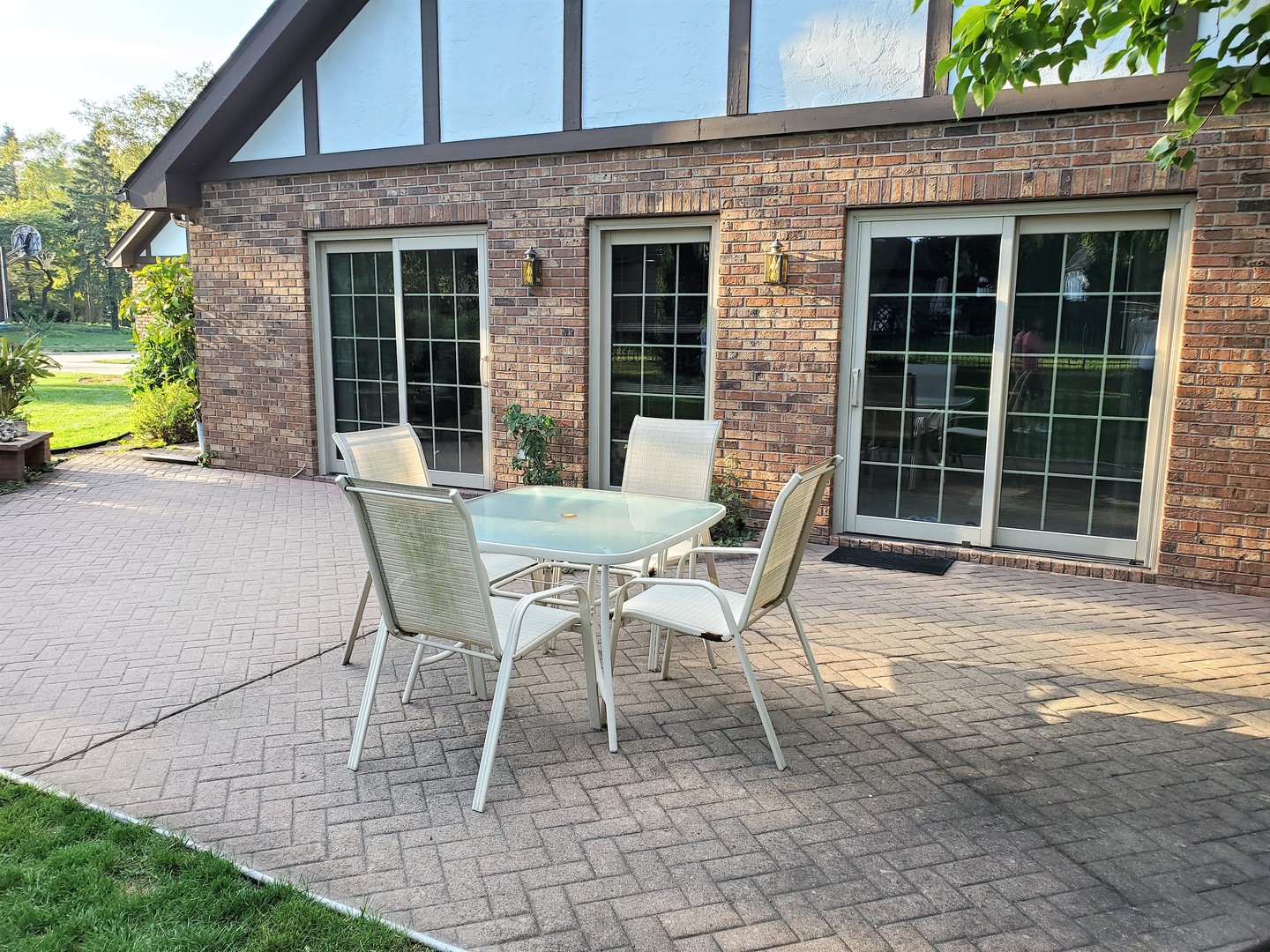 1013 Galen Drive Champaign, IL 61821 - Photo 29 of 68 a patio with a table and chairs and potted plants