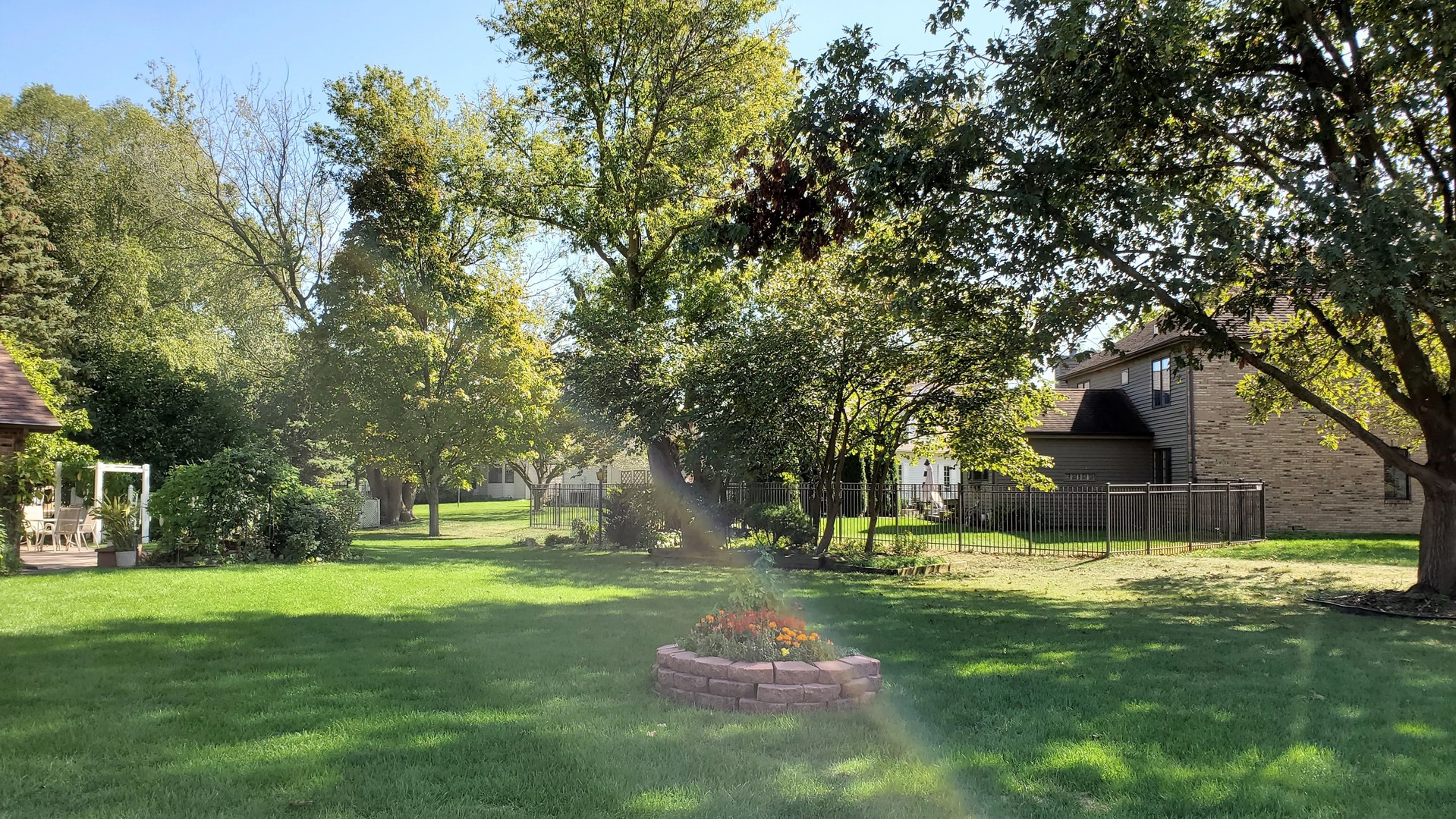 1013 Galen Drive Champaign, IL 61821 - Photo 30 of 68 a view of a white house with a big yard and large trees