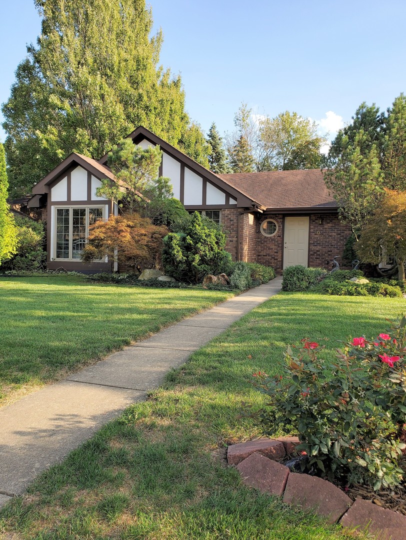 1013 Galen Drive Champaign, IL 61821 - Photo 4 of 68 a front view of a house with yard and green space