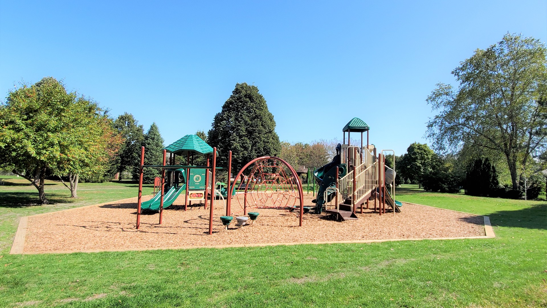 1013 Galen Drive Champaign, IL 61821 - Photo 58 of 68 a park with lots of swings and slides