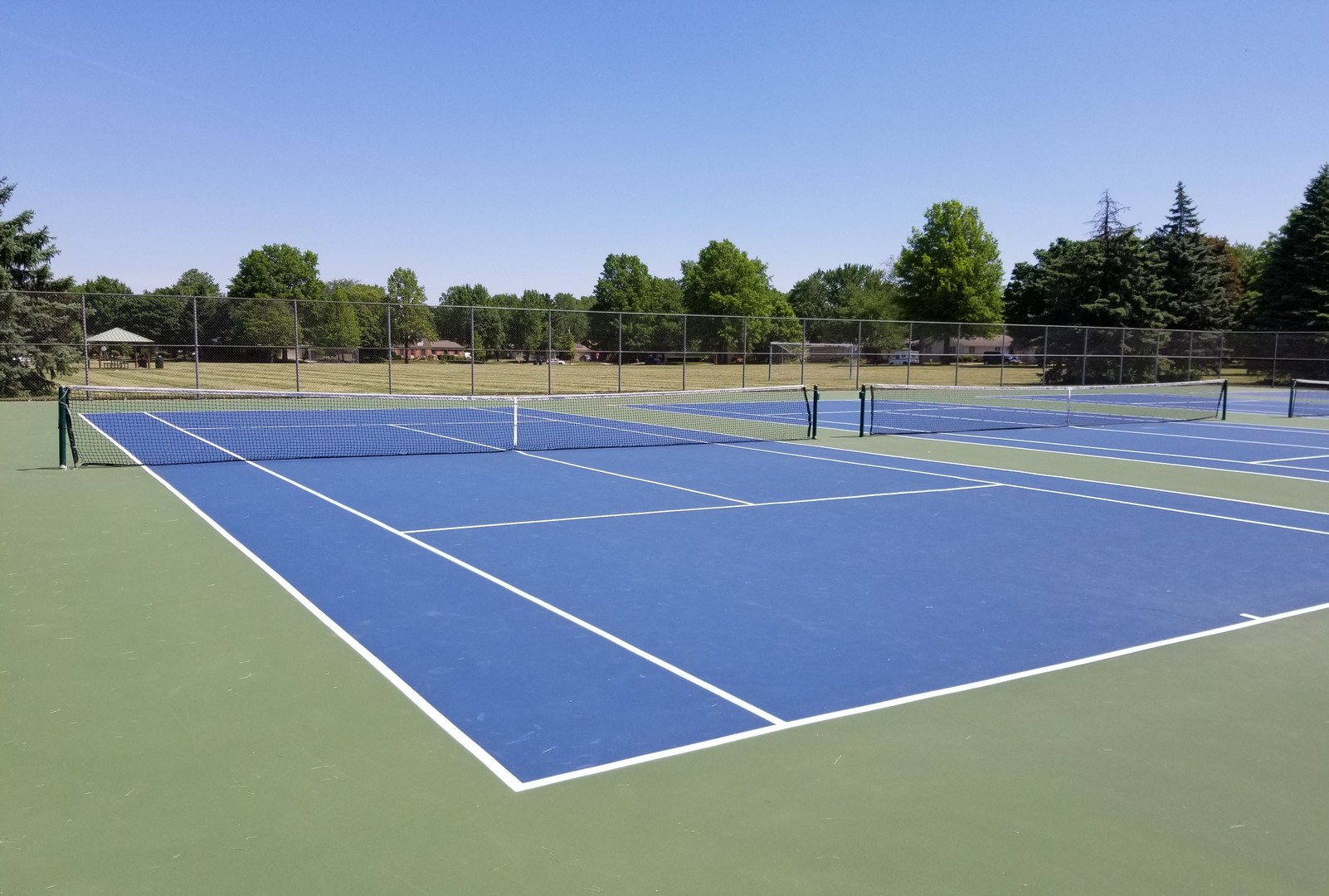 1013 Galen Drive Champaign, IL 61821 - Photo 65 of 68 a view of an outdoor space and tennis court