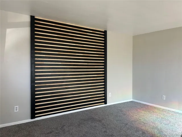 a view of a room with a large window