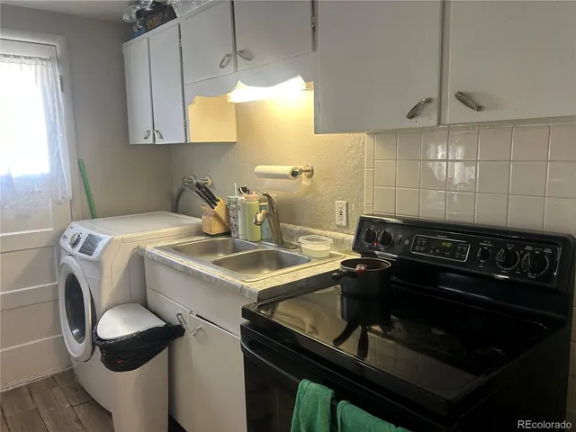 a kitchen with a stove and a sink