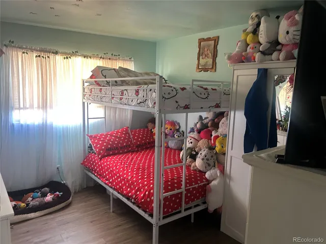 a bed room with a bed and a window