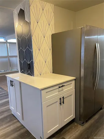 a utility room with wooden floor