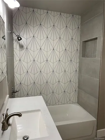 a bathroom with a sink and a bathtub