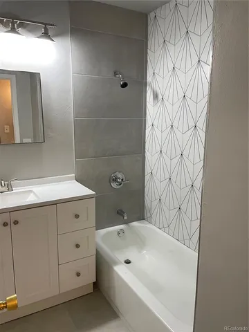 a bathroom with a bathtub and a sink