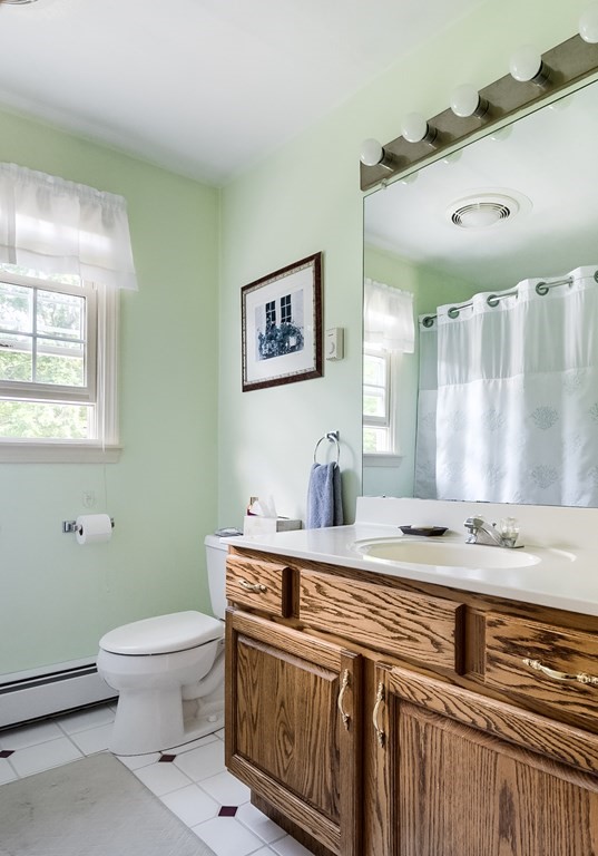 8 10 Rod Road Rutland, MA 01543 - Photo 19 of 32 a bathroom with a granite countertop sink a toilet and a mirror