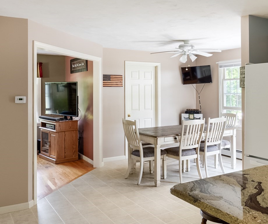 8 10 Rod Road Rutland, MA 01543 - Photo 7 of 32 a dining room with furniture and wooden floor
