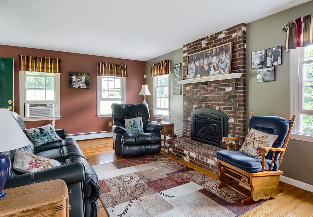 8 10 Rod Road Rutland, MA 01543 - Photo 10 of 32 a living room with furniture and a fireplace