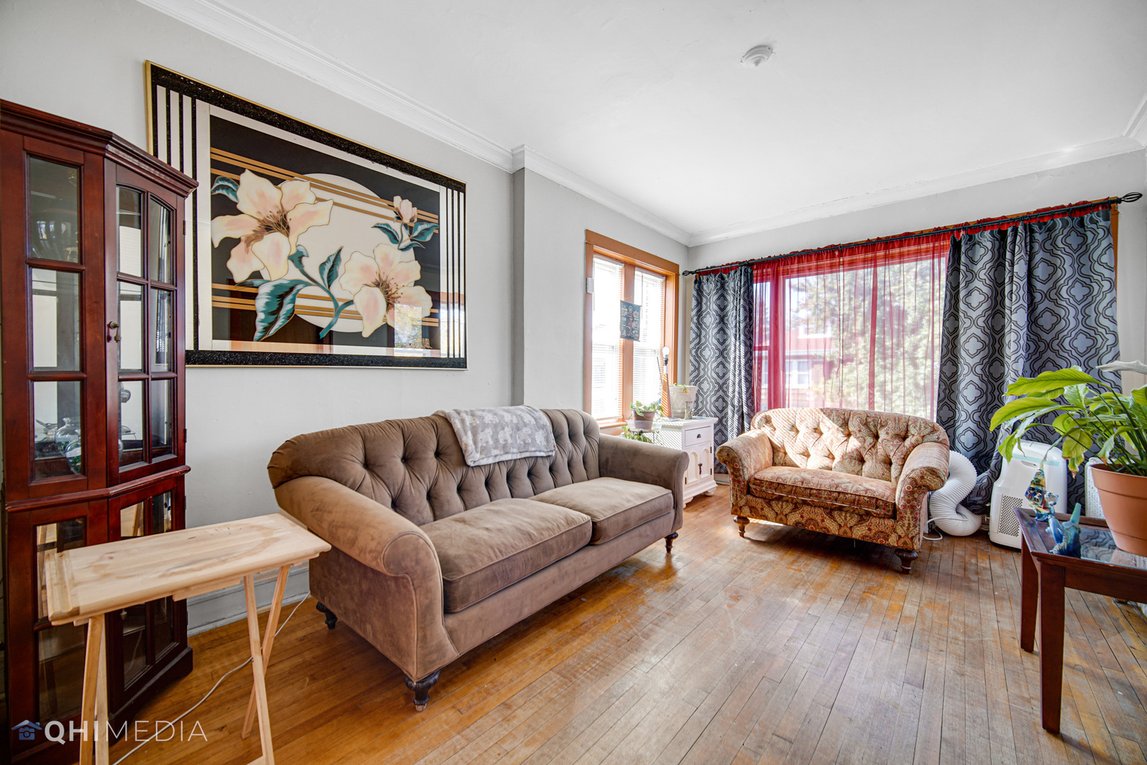 8417 South Manistee Avenue Chicago, IL 60617 - Photo 11 of 25 a living room with furniture a couch and a large window