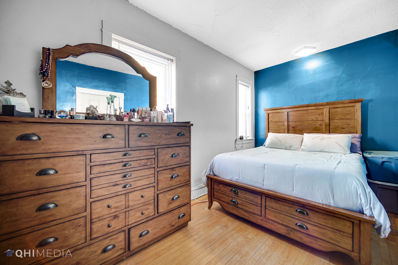 8417 South Manistee Avenue Chicago, IL 60617 - Photo 15 of 25 a bedroom with a bed and a dresser