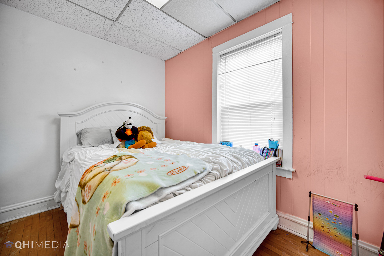 8417 South Manistee Avenue Chicago, IL 60617 - Photo 16 of 25 a bedroom with a bed and a window