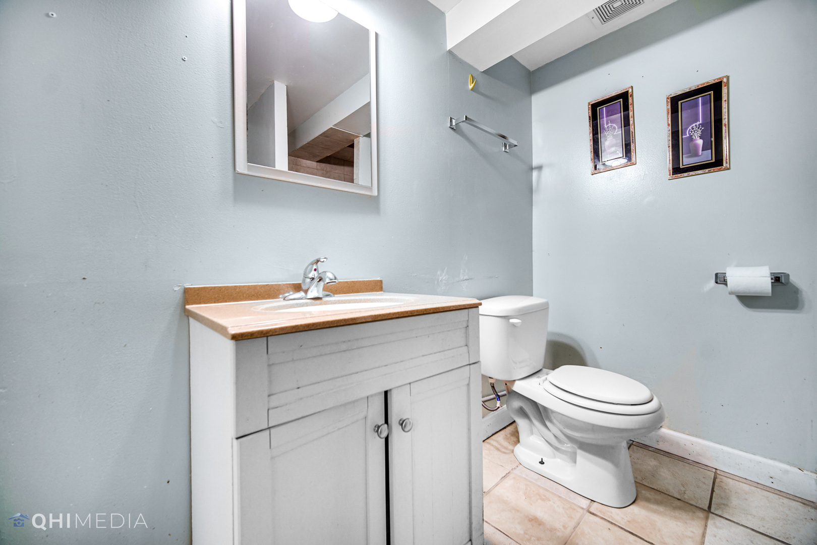 8417 South Manistee Avenue Chicago, IL 60617 - Photo 22 of 25 a bathroom with a sink mirror and toilet