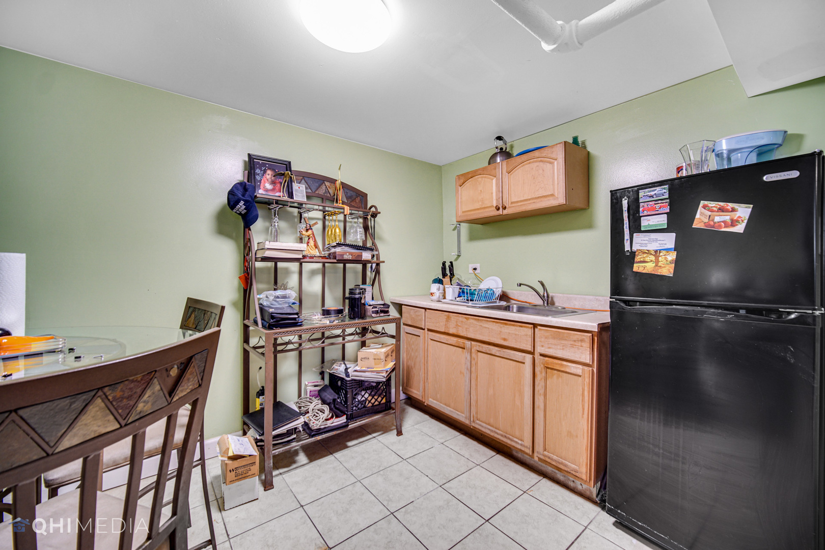 8417 South Manistee Avenue Chicago, IL 60617 - Photo 24 of 25 a kitchen with stainless steel appliances granite countertop a sink and cabinets