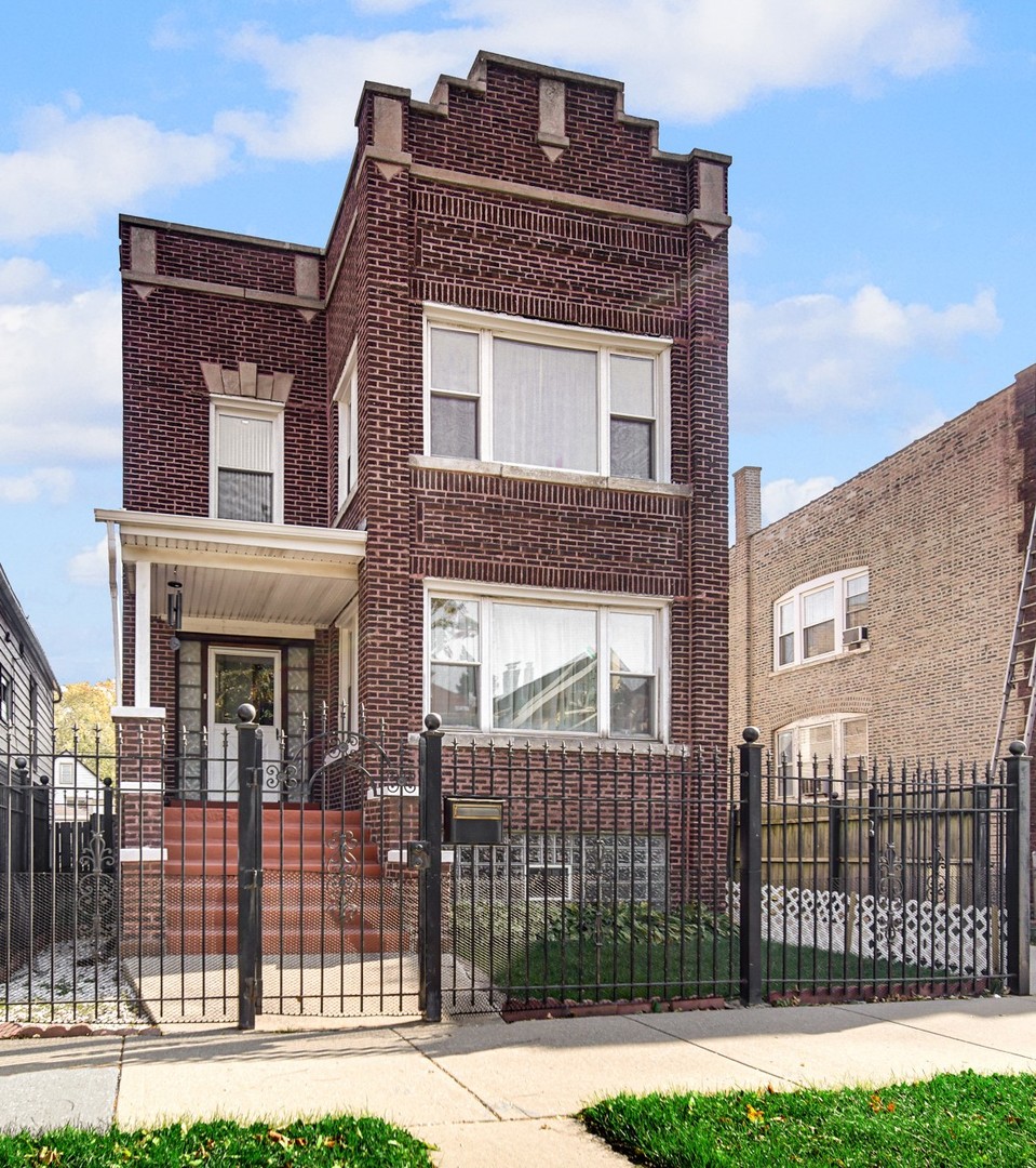 8417 South Manistee Avenue Chicago, IL 60617 - Photo 3 of 25 a front view of a house