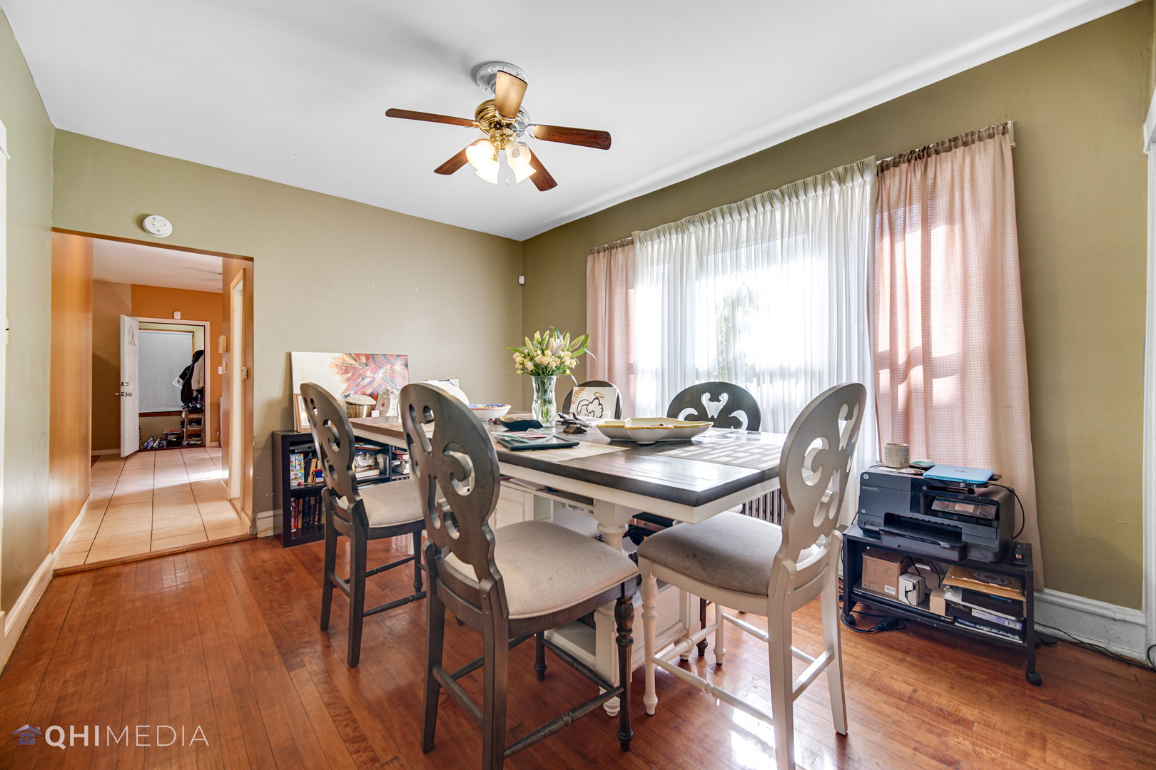 8417 South Manistee Avenue Chicago, IL 60617 - Photo 6 of 25 a view of a dining room with furniture window and wooden floor