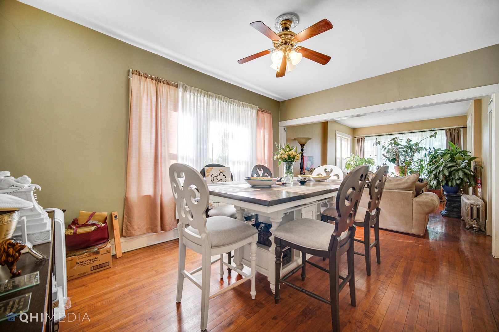8417 South Manistee Avenue Chicago, IL 60617 - Photo 7 of 25 a view of a a dining room with furniture window and wooden floor