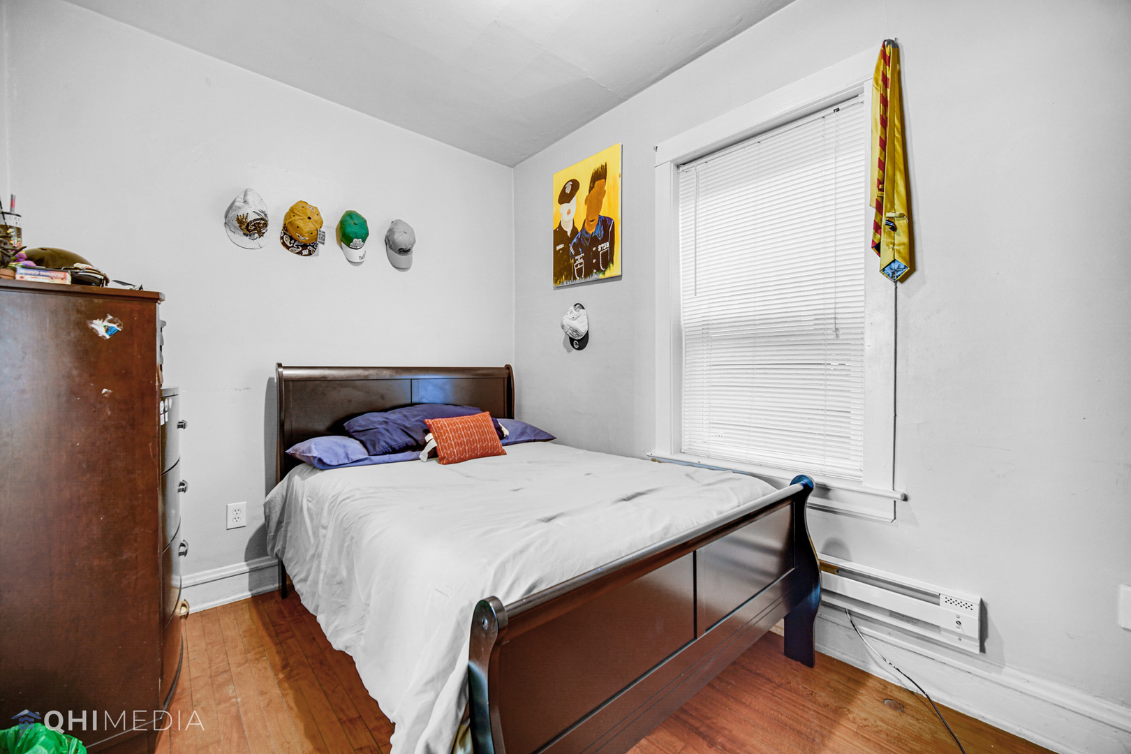 8417 South Manistee Avenue Chicago, IL 60617 - Photo 8 of 25 a bedroom that has a bed and a table in it
