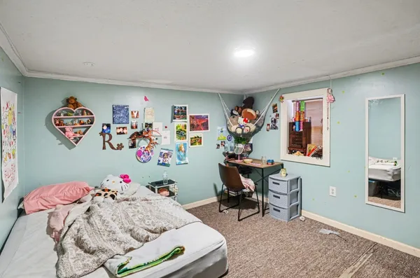 a bedroom with furniture and a bed