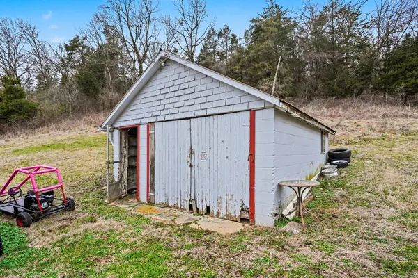 a view of a house with a garage and chair