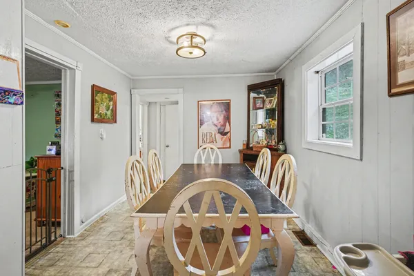a view of a livingroom with furniture hardwood floor and a window