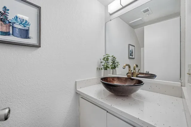 a room with a table and a potted plant
