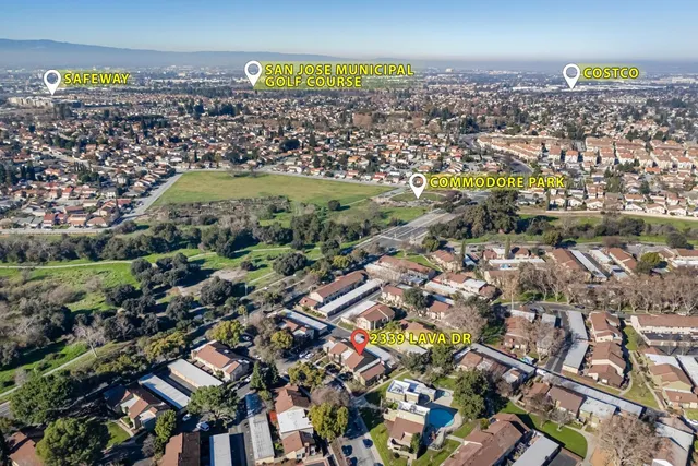 an aerial view of a house with garden space sitting space and swimming pool