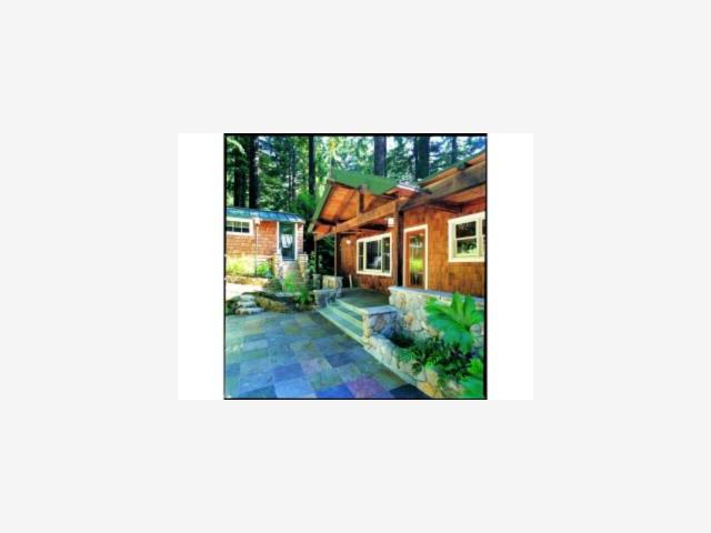 a picture of a bench in front of a building