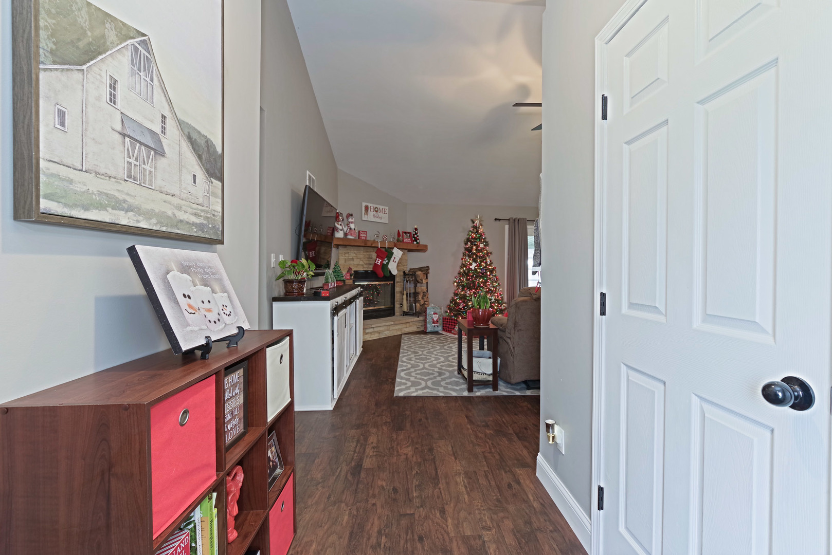 319 West Cermak Road Braidwood, IL 60408 - Photo 4 of 32 a view of a hallway with workspace and wooden floor