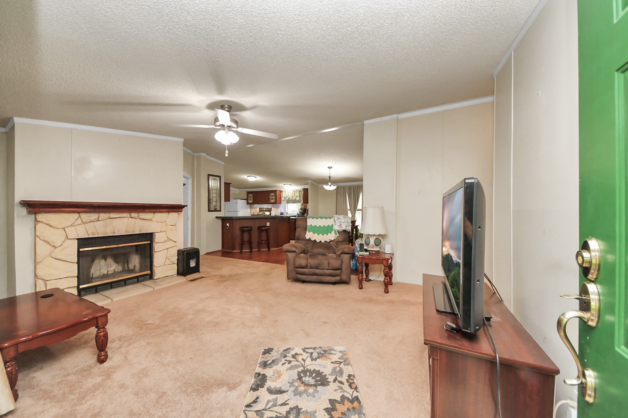 204 Edith Street Highlands, TX 77562 - Photo 4 of 33 a living room with furniture and a fireplace