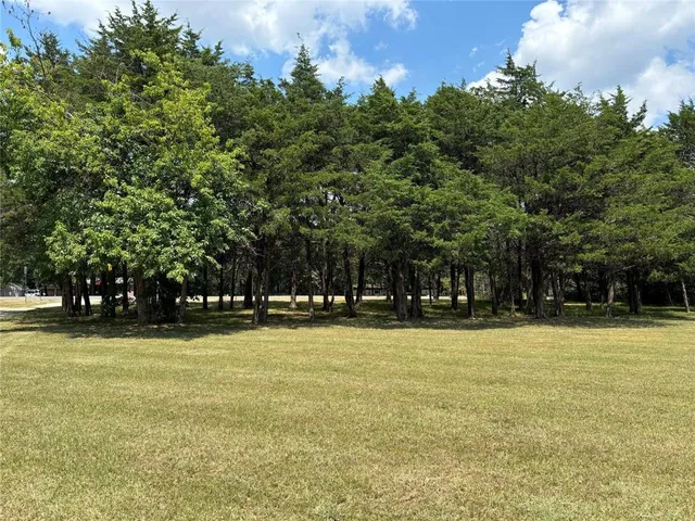 a view of a swimming pool with an outdoor space and seating area