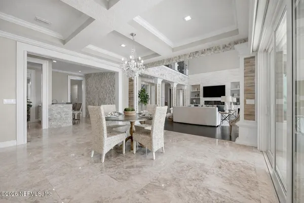 a bathroom with a granite countertop sink a mirror and a shower