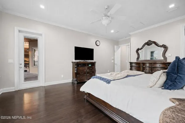 a bathroom with a granite countertop sink a toilet and a mirror