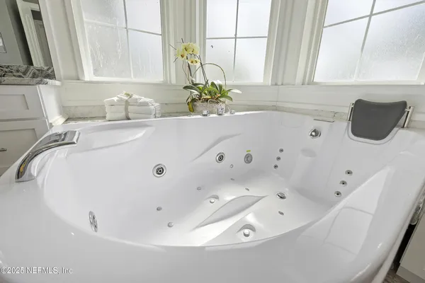 a view of a patio with a table and chairs